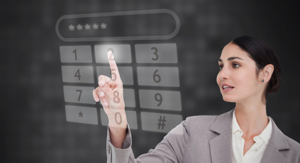 <p>Businesswoman using touch screen against a black background</p>