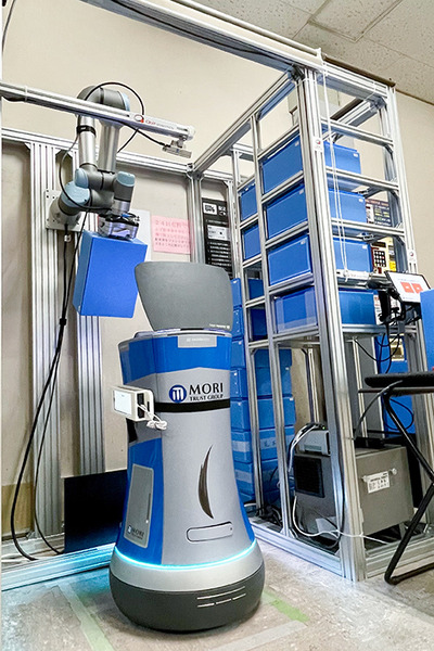 QBITと森トラストの自動搬送ロボット実証実験(2)　協働ロボット「館内の配送・集荷業務の自動化」の未来　デモ動画を公開