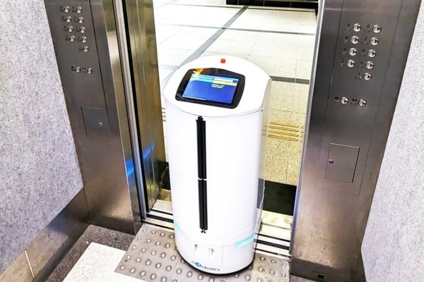 日本オーチス、大分県庁で自動搬送ロボットとのエレベータ連携実証に成功　県庁内で郵便物や小包を自動搬送、顔認証も活用