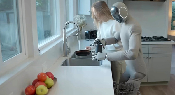 1Xの家庭用ヒューマノイド新型モデルが NVIDIAのCEOに特製の革ジャンをプレゼント　皿洗いを学習する動画を公開