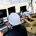 遠隔操作の建機が消防隊と連携して災害時の模擬防災訓練を実施　有効性と可能性を確認