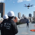ドローンが上空から応援メッセージを届ける「第10回神戸マラソン」でスピーカー搭載ドローンを活用