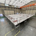 清水建設『ステージ足場移動台車』にAGV/AMR向け駆動ユニットを採用　ナブテスコが発表